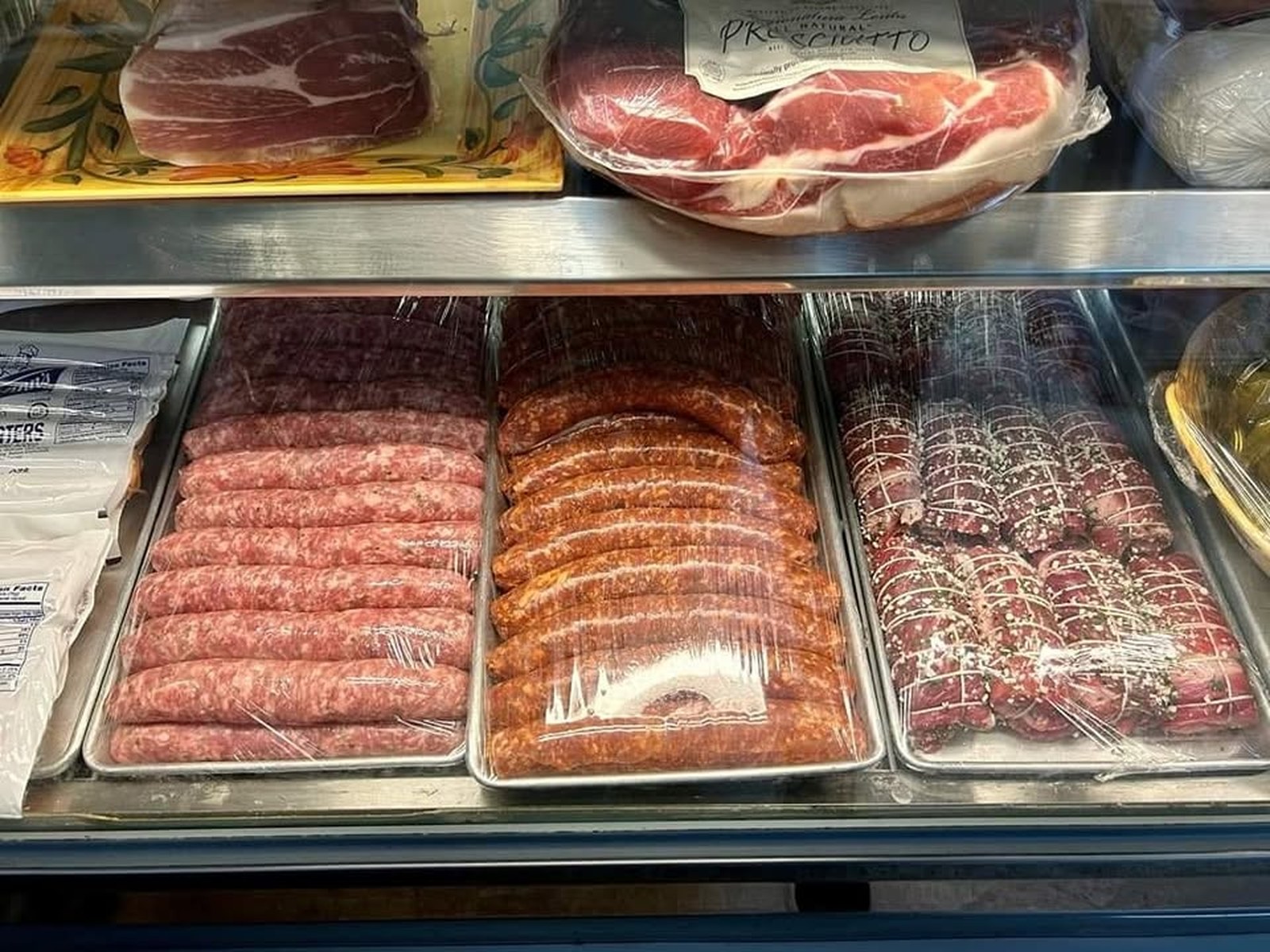 Antonio's deli counter with fresh meats, cheeses, and prepared foods