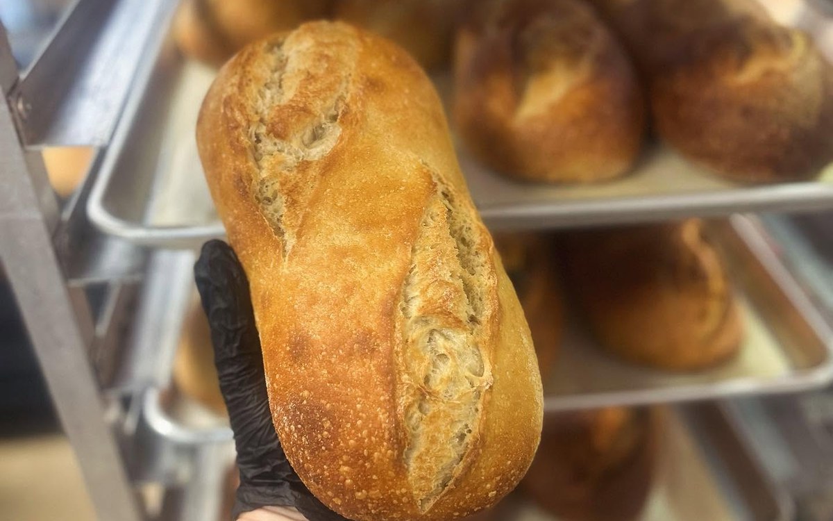 Fresh sourdough loaves with a crackly crust from Izzy’s Bakery